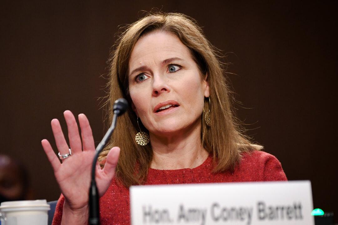 (Left) Supreme Court nominee Judge Ketanji Brown Jackson testifies during her confirmation hearing in Washington on March 22, 2022. (Right) Supreme Court nominee Judge Amy Coney Barrett testifies during her confirmation hearing in Washington on Oct. 13, 2020. (Anna Moneymaker/Getty Images, Kevin Dietsch/Pool/Getty Images)