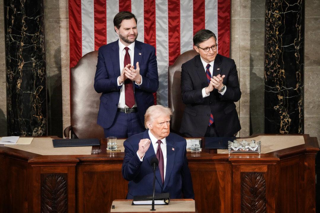 Vice President JD Vance and Speaker of the House Mike Johnson (R-La.) applaud as President Donald Trump addresses a joint session of Congress at the U.S. Capitol on March 4, 2025. The Trump administration has collected nearly $90 billion in revenue in fiscal year 2025 from the tariffs challenged in this case. (Andrew Harnik/Getty Images)