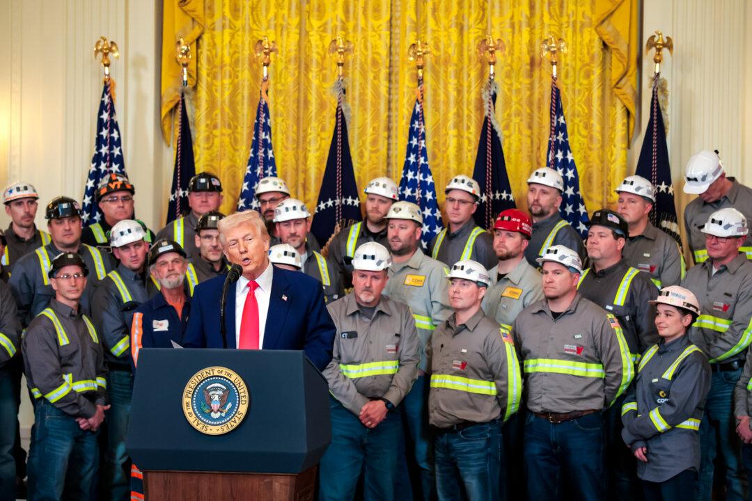 President Donald Trump speaks alongside coal and energy workers during an executive order signing ceremony in the East Room of the White House on April 8, 2025. The Trump administration is countering a wave of state-level climate lawsuits filed against energy companies. (Anna Moneymaker/Getty Images)