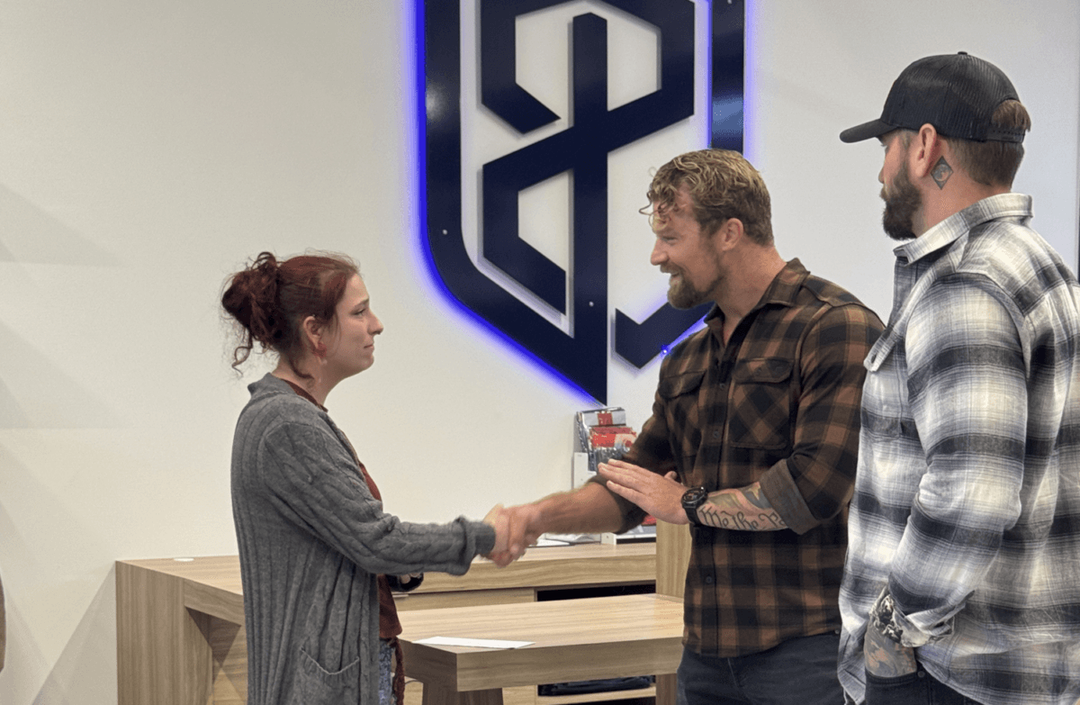 Army veteran Lynzi Felder (L) meets and shakes hands with Born Primitive CEO and Navy SEAL veteran Bear Handlon (C) and Black Rifle Coffee Company co-founder and Army Ranger veteran Mat Best (R). (Courtesy of Born Primitive)