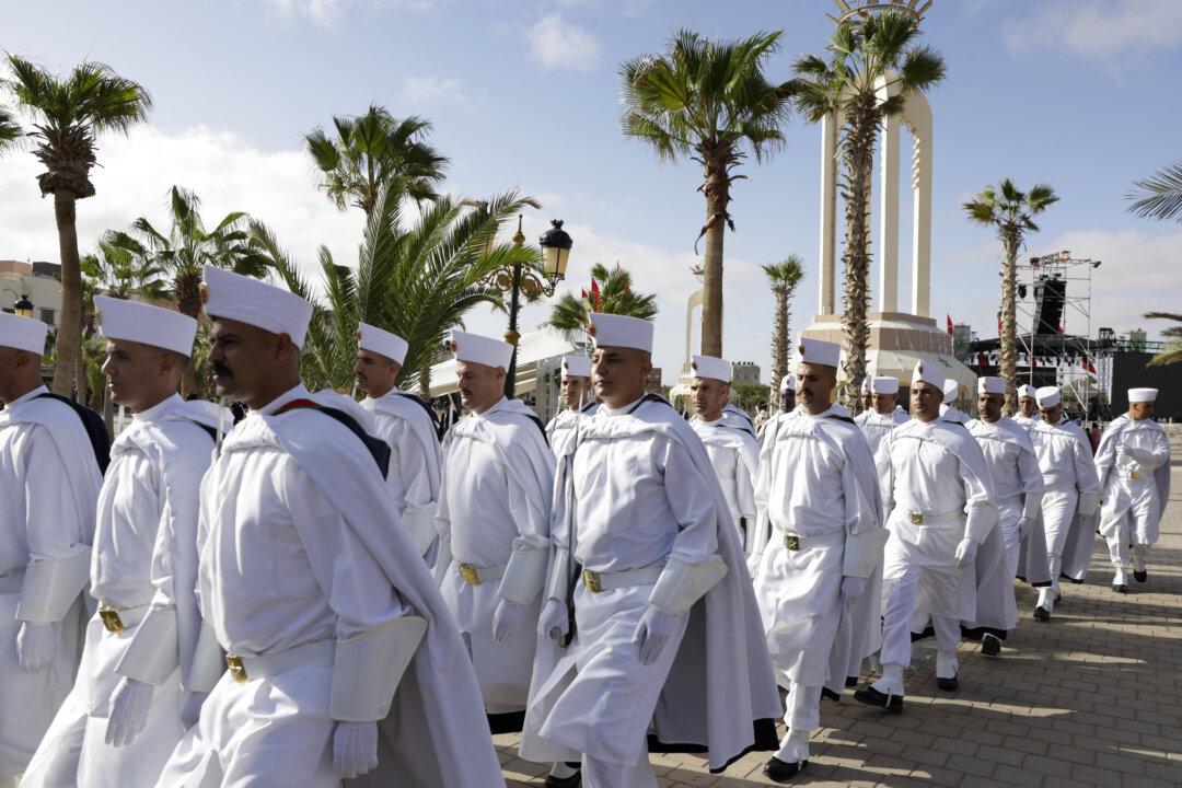 Members of Morocco's Auxiliary Forces assemble on Mechouar Square in Laayoune, the biggest city of the Western Sahara, on Nov. 6, 2025, to attend commemorations of the so-called Green March of 1975, when 350,000 Moroccans marched to the border of what was then Spanish Sahara to pressure Madrid into handing over the territory. The UN Security Council voted on Oct. 31, 2025, in favor of a resolution backing Morocco's autonomy plan for Western Sahara as the “most feasible” solution for the disputed territory, triggering celebrations in Rabat but angering Algeria. (Abdel Majid Bziouat/AFP via Getty Images)
