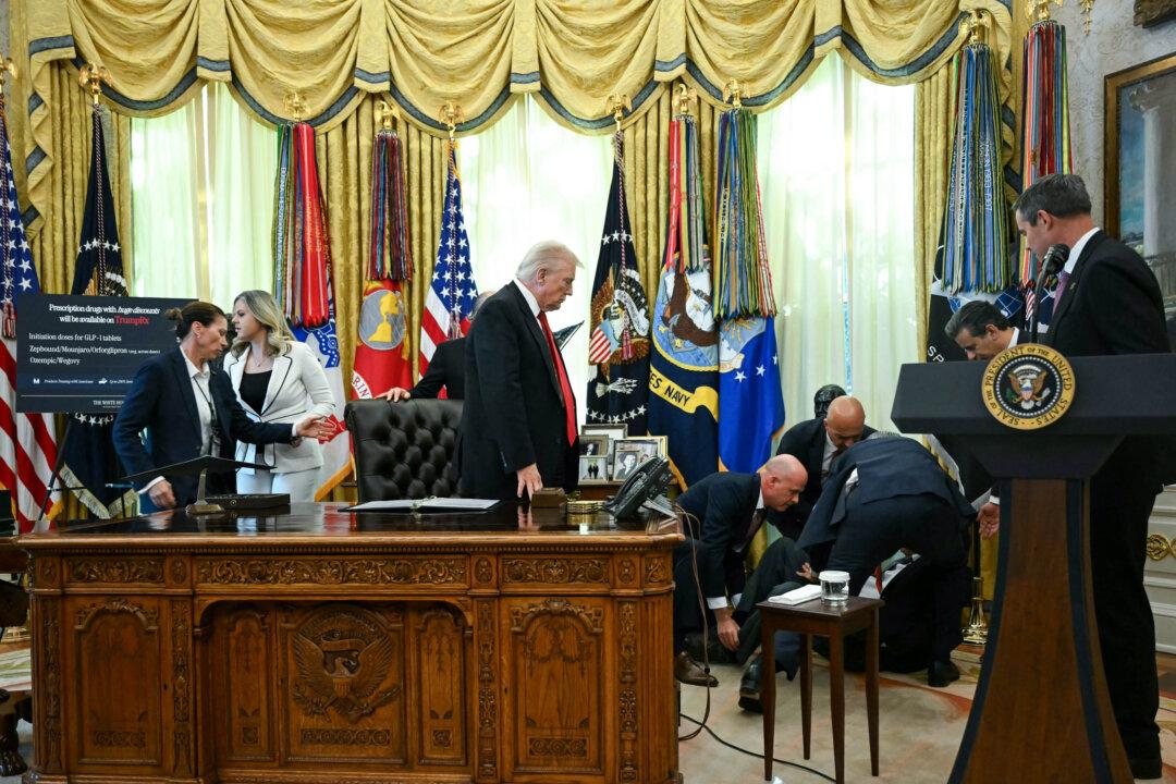 President Donald Trump looks on after a man fainted during an announcement about weight-loss drugs in the Oval Office of the White House in Washington on Nov. 6, 2025. (Andrew Caballero-Reynolds/AFP via Getty Images)