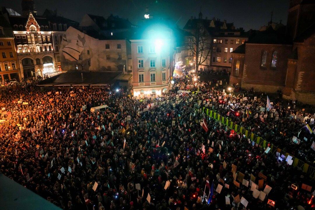 Thousands of demonstrators hold banners and placards on Nov. 6, 2025, at Dome Square in Riga, to protest Latvia's bid to withdraw from the Istanbul Convention, designed to protect women from gender-based and domestic violence. Rights activists and Latvia's President Edgars Rinkēvičs had criticized the initial decision by lawmakers to pull out of the Convention. He returned the bill to the parliament for reconsideration on Nov. 3, 2025, saying in a statement it “sent a contradictory message to both Latvian society and Latvia's allies.” (Gints Ivuskans/AFP via Getty Images)