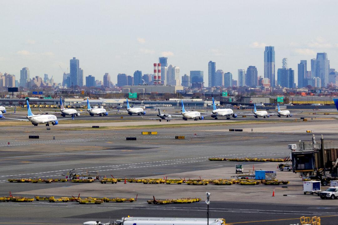 With the New York City skyline in the background, United Airlines flights are lined up for takeoff at Newark Liberty International Airport in Newark, N.J., on Nov. 7, 2025. (Timothy A. Clary/AFP via Getty Images)