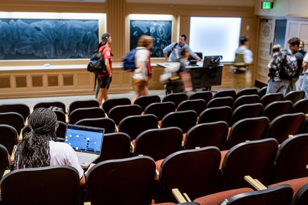 A student sits in a lecture hall as class ends at the University of Texas at Austin on Feb. 22, 2024. Emphasis on publishing volume in academia has long been tied to job security and funding, but Michal Prywata says that the incentive system must change, with researchers and institutions held financially liable for fabricated work. (Brandon Bell/Getty Images)