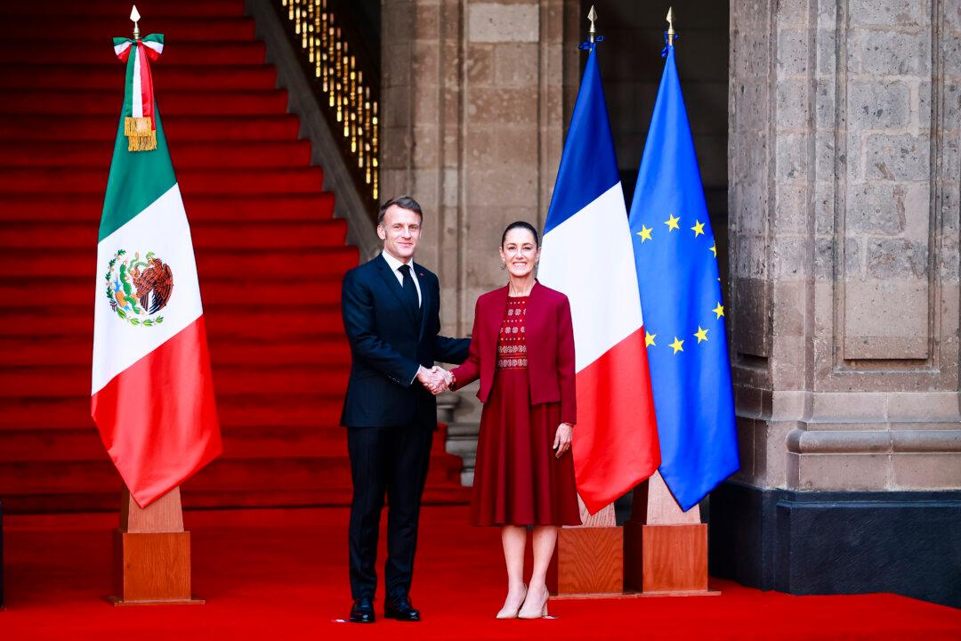 President of France Emmanuel Macron and President of Mexico Claudia Sheinbaum shake hands during a welcome ceremony as part of an official visit to Mexico at Palacio Nacional in Mexico City, Mexico, on Nov. 7, 2025. (Eloisa Sanchez/Getty Images)