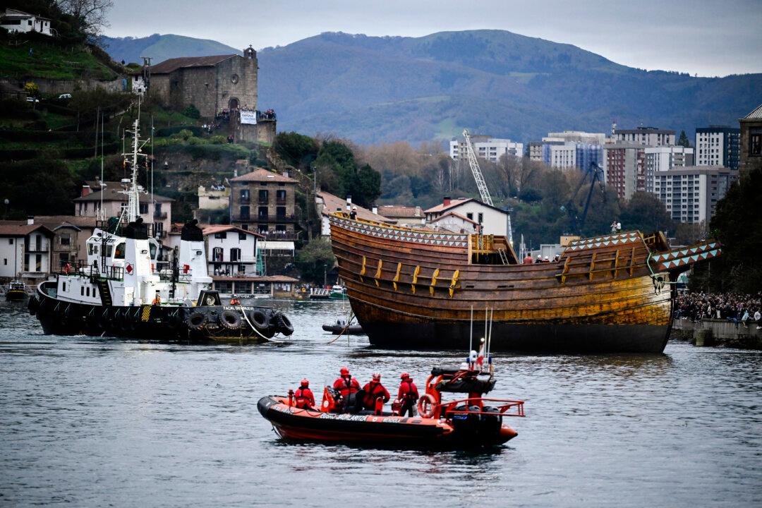 A meticulously crafted scientific replica of the 16th-century transoceanic Basque whaling carrack, the Nao San Juan, is towed during launch at Albaola Maritime Factory in the Spanish Basque town of Pasaia on Nov. 7, 2025. The original vessel, which sank in 1565 off the coast of Labrador, Canada, is considered the best-preserved and most documented commercial shipwreck of her era, earning her recognition as a symbol of UNESCO's Underwater Cultural Heritage. (Ander Gillenea/AFP via Getty Images)