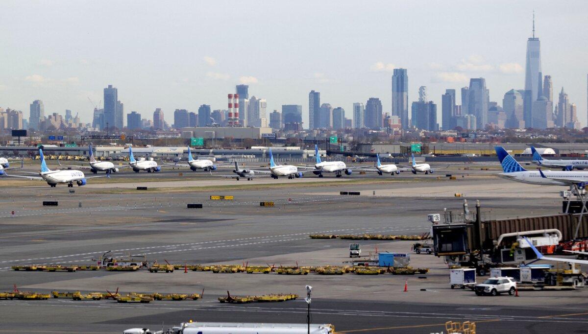 With the New York City skyline in the background, United Airlines flights are lined up for takeoff at Newark Liberty International Airport in Newark, New Jersey, on Nov. 7, 2025. (Timothy A. Clary/AFP)