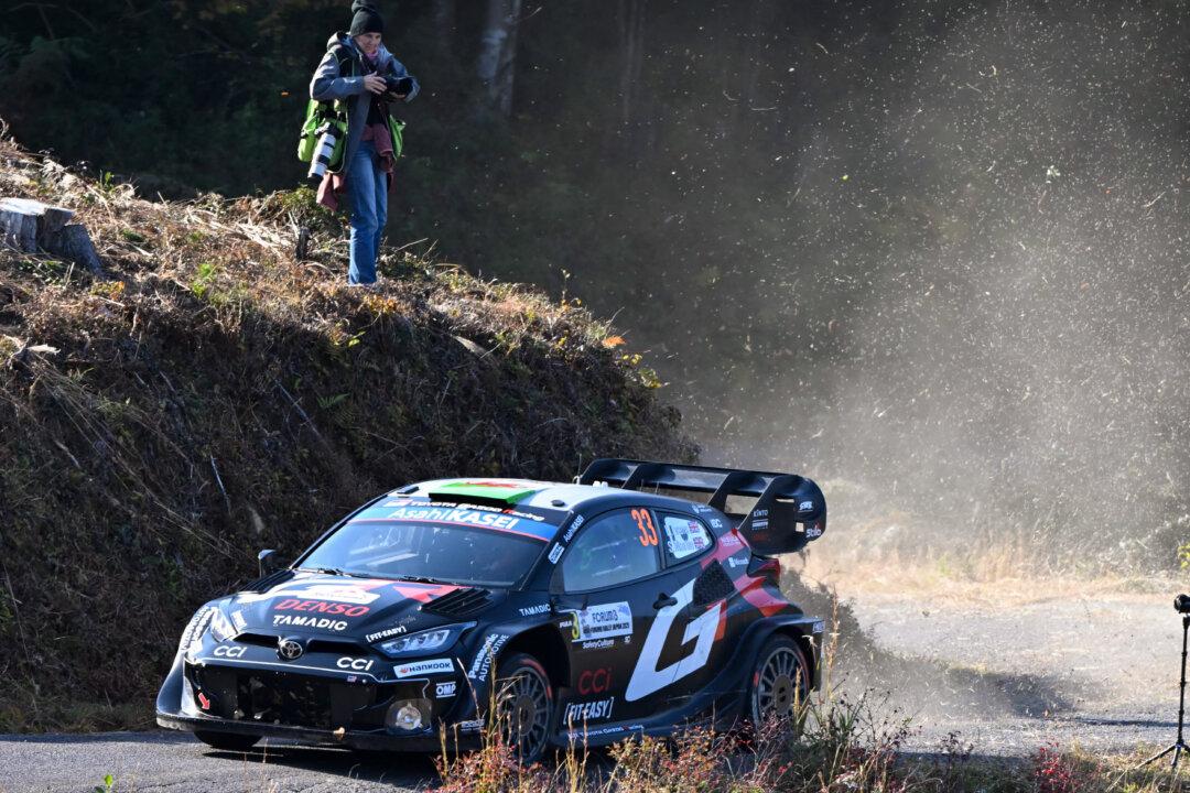 Elfyn Evans and his co-driver Scott Martin of Britain drive their Toyota GR Yaris Rally1 during the SS9 Ena section of the Rally Japan, the 13th round of the FIA World Rally Championships, in Ena city, Gifu prefecture, Japan, on Nov. 8, 2025. (Toshifumi Kitamura/AFP via Getty Images)