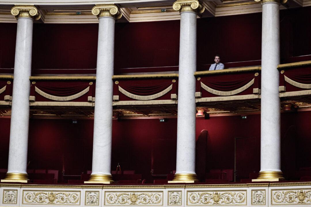 An attendee looks on during a session to examine France's 2026 social security budget bill at the Assemblee Nationale, the French Parliament’s lower house, in Paris, on Nov. 8, 2025. (Stephane De Sakutin/AFP via Getty Images)
