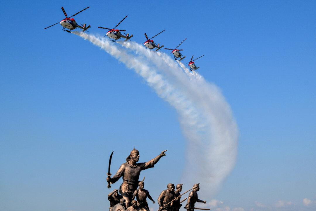 Indian Air Force ALH Mk1 helicopters soar through the sky as part of the 93rd Air Force Day celebrations in Guwahati, India, on Nov. 8, 2025. (Biju Boro/AFP via Getty Images)