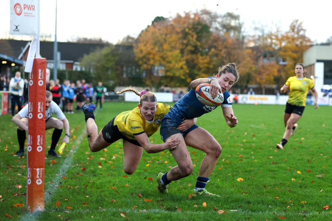 Rhona Lloyd of Sale Sharks goes over for a try under pressure from Carys Cox of Trailfinders during the Premiership Women's Rugby match between Sale Sharks and Ealing Trailfinders at Morson Stadium in Salford, England, on Nov. 8, 2025. (Jan Kruger/Getty Images for Sale Sharks)