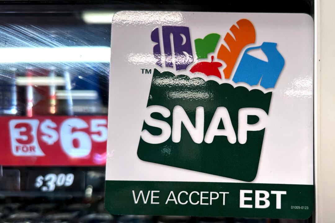 A SNAP EBT information sign at a gas station in Riverwoods, Ill., on Nov. 1, 2025. The Department of Homeland Security is seeking to change a rule to encourage self-reliance and prevent public benefits from becoming an incentive for immigration. (Nam Y. Huh/AP Photo)