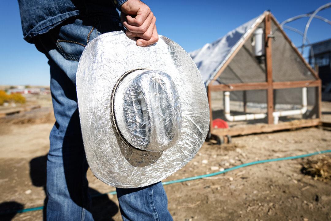 AJ Richards works at his home outside Cody, Wyo., on Oct. 14, 2025. Richards said the fear of not being able to feed his own children led him to start From the Farm. (John Fredricks/The Epoch Times)