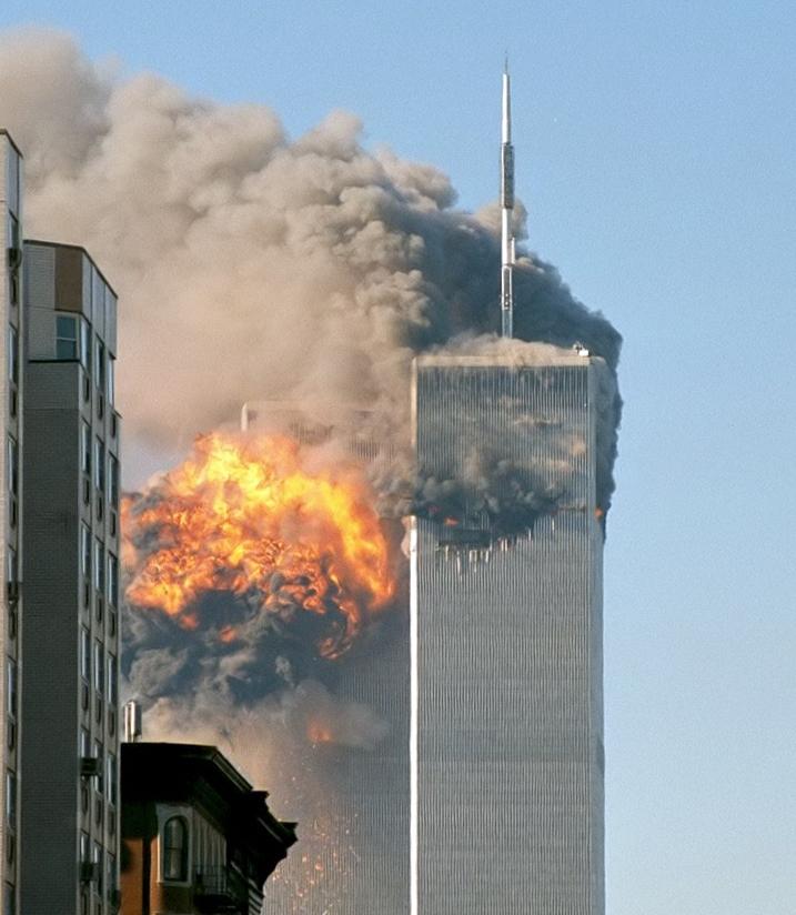 The northeast face of the South Tower exploding. Cropped. (<a href="https://www.flickr.com/people/themachinestops/">Robert</a>/<a href="https://creativecommons.org/licenses/by-sa/2.0">CC BY-SA 2.0</a>)