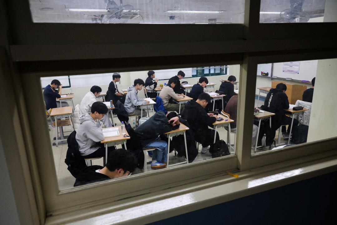 Students wait for the start of the annual college entrance exam, known locally as Suneung, at an exam hall in Seoul, South Korea, on Nov. 13, 2025. (Kim Hong-Ji/POOL/AFP via Getty Images)