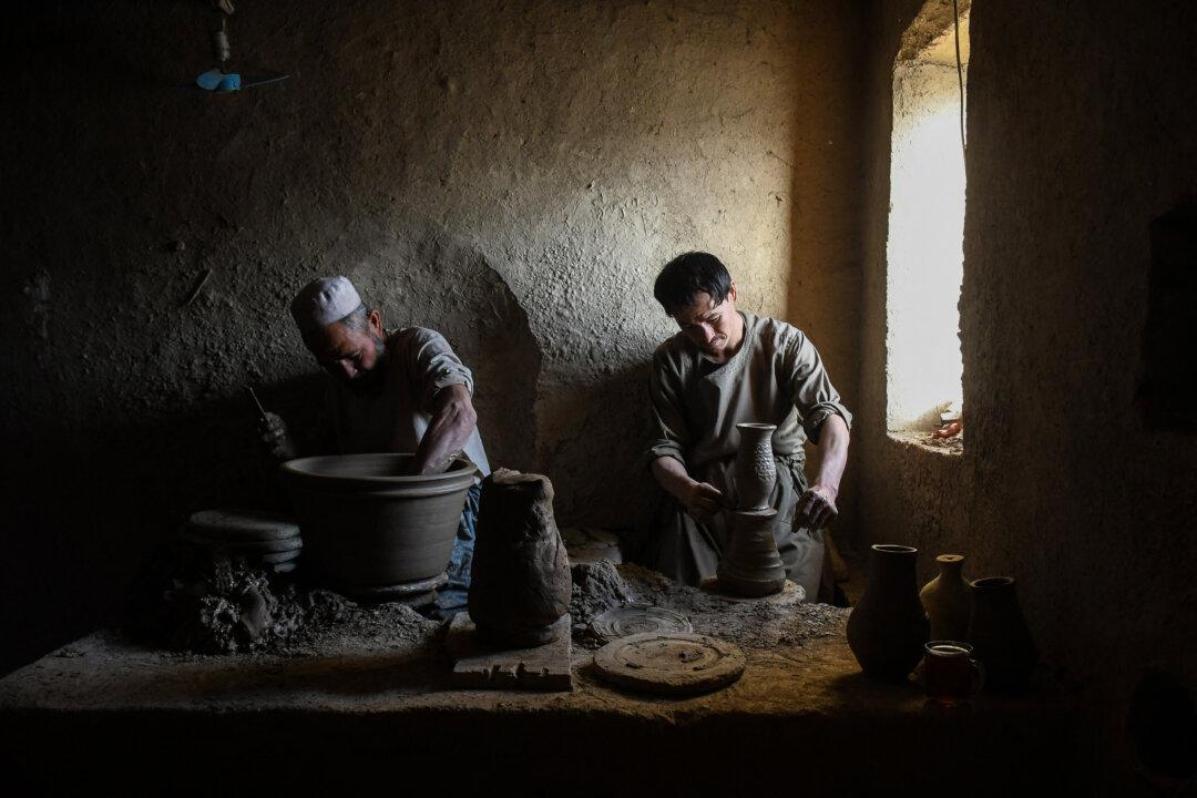 Afghan men make clay pots at a pottery workshop in the Dawlatabad district of Balkh province, on Nov. 13, 2025. (Atif Aryan/AFP via Getty Images)