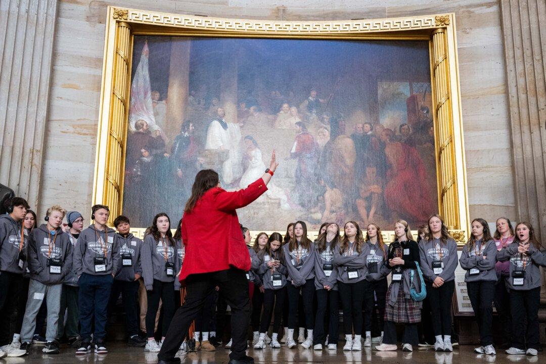 A tour guide leads a group through the U.S. Capitol in Washington on Nov. 13, 2025, a day after the U.S. government reopened. The government was set to take the first tentative steps towards reopening on Thursday after President Donald Trump signed a bill to end the longest federal shutdown in U.S. history. (Andrew Caballero-Reynolds/AFP via Getty Images)