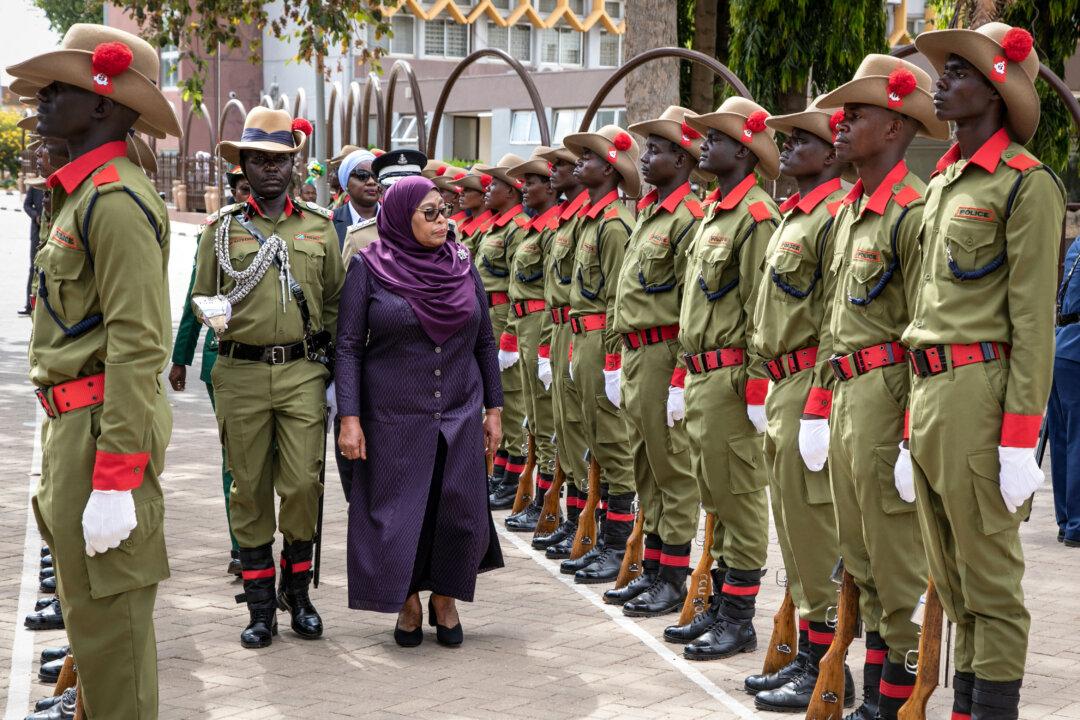 President Samia Suluhu Hassan inspects a guard of honor during the inauguration of the 13th Parliament in Dodoma, Tanzania, on Nov. 14, 2025. She announced an inquiry into election-related killings. (AFP via Getty Images)
