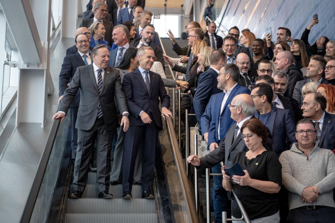 Prime Minister Mark Carney and Quebec Premier François Legault arrive for the inauguration of a new REM line in Montreal, Canada, on Nov. 14, 2025. (Andrej Ivanov/AFP via Getty Images)