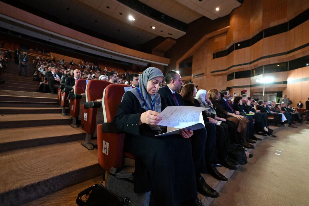 Delegates react during a day of dialogue with Syrian civil society, a first step toward structured dialogue with the Syrian government and the European Union, at Conference Palace near Damascus, on Nov. 15, 2025. (Louai Beshara/AFP via Getty Images)