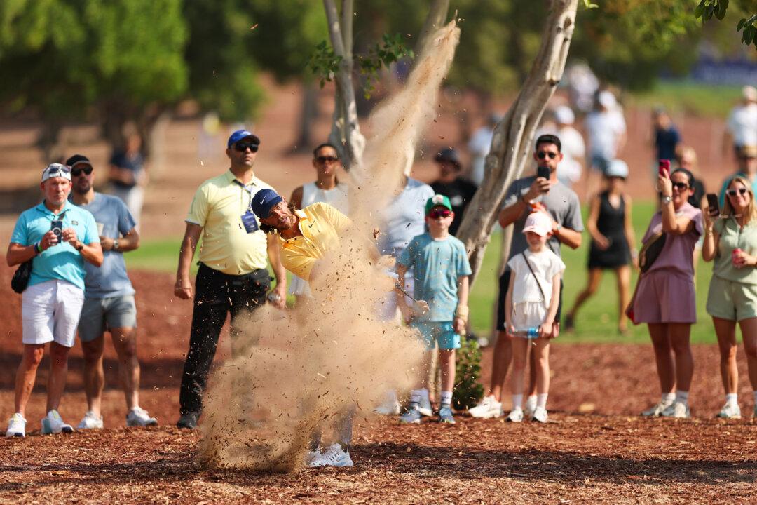 Tommy Fleetwood of England plays his second shot on the first hole on day three of the DP World Tour Championship 2025 at Jumeirah Golf Estates in Dubai, United Arab Emirates, on Nov. 15, 2025. (Richard Heathcote/Getty Images)