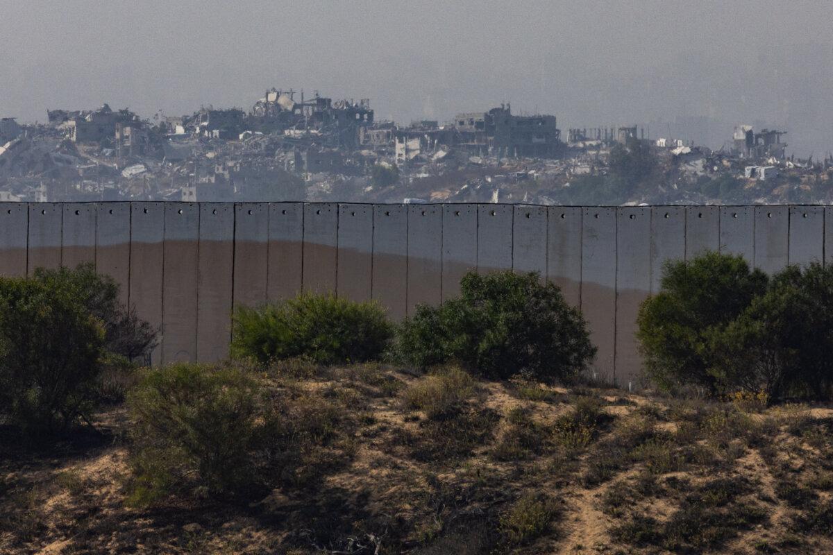 The skyline of Beit Lahia in the Gaza Strip as seen from over the Israeli border wall on Nov. 19, 2025. (John Fredricks/The Epoch Times)