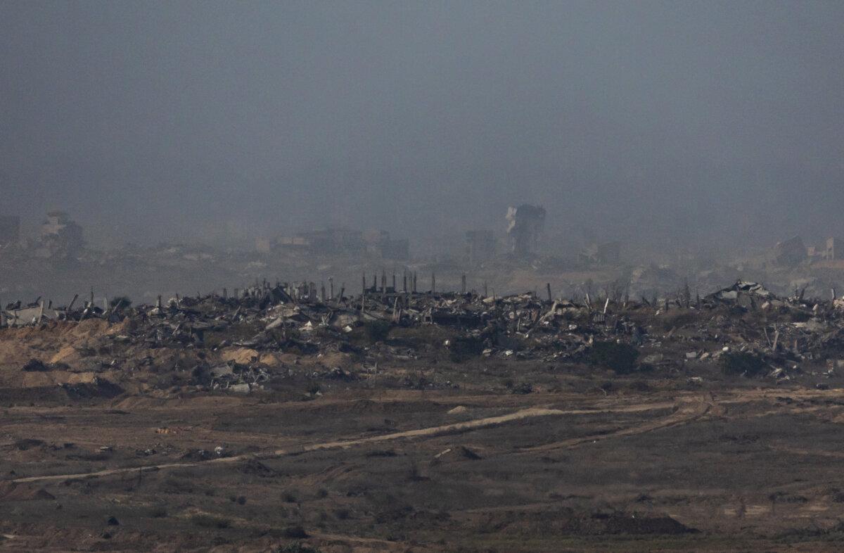 Haze fills in the battle-torn skyline of the city of Beit Lahiya, Gaza, on Nov. 19, 2025. (John Fredricks/The Epoch Times)