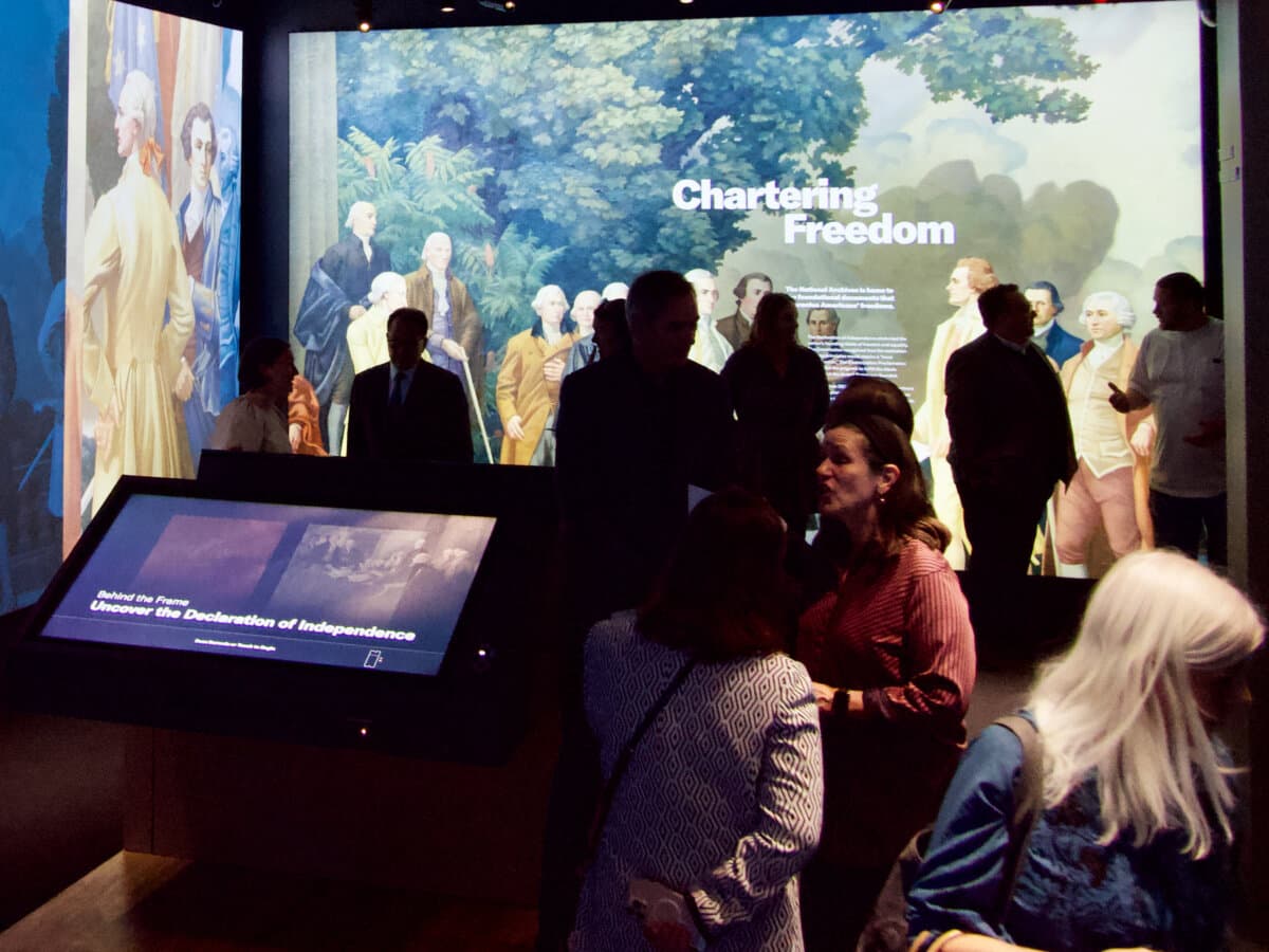 Visitors explore "The American Story," a new exhibit at the National Archives in Washington, as seen during a grand opening preview on Nov. 21, 2025. (Travis Gillmore/The Epoch Times)