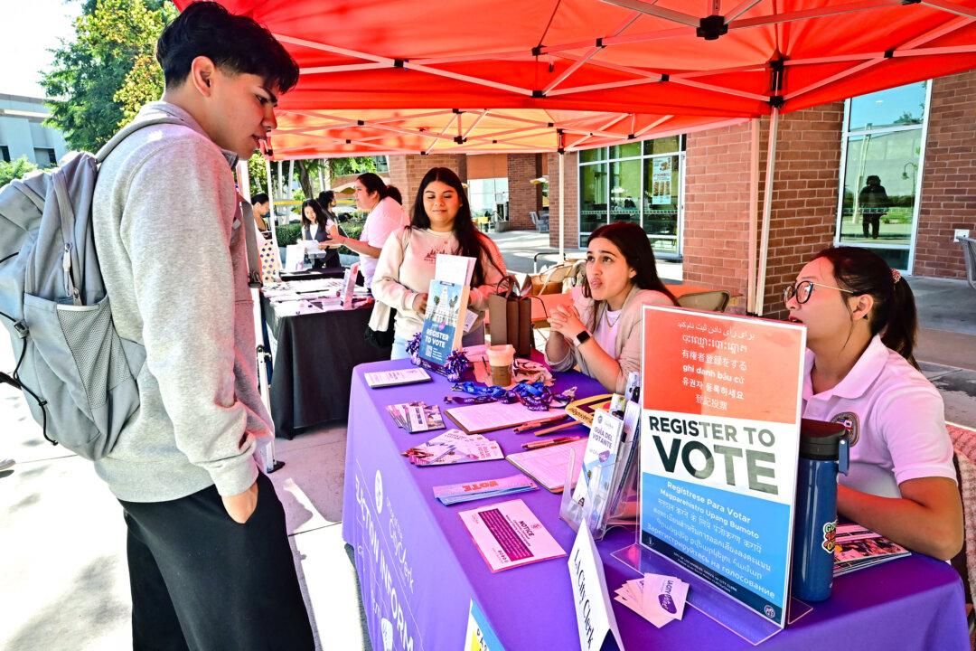 Young voters get information at a voter registration desk during Voter Fest 2024 at California State University–Los Angeles on Oct. 22, 2024. Census data indicate that millennials and Generation Z will make up a majority of potential U.S. voters by 2028 and more than 60 percent by 2036. (Frederic J. Brown/AFP via Getty Images, File)