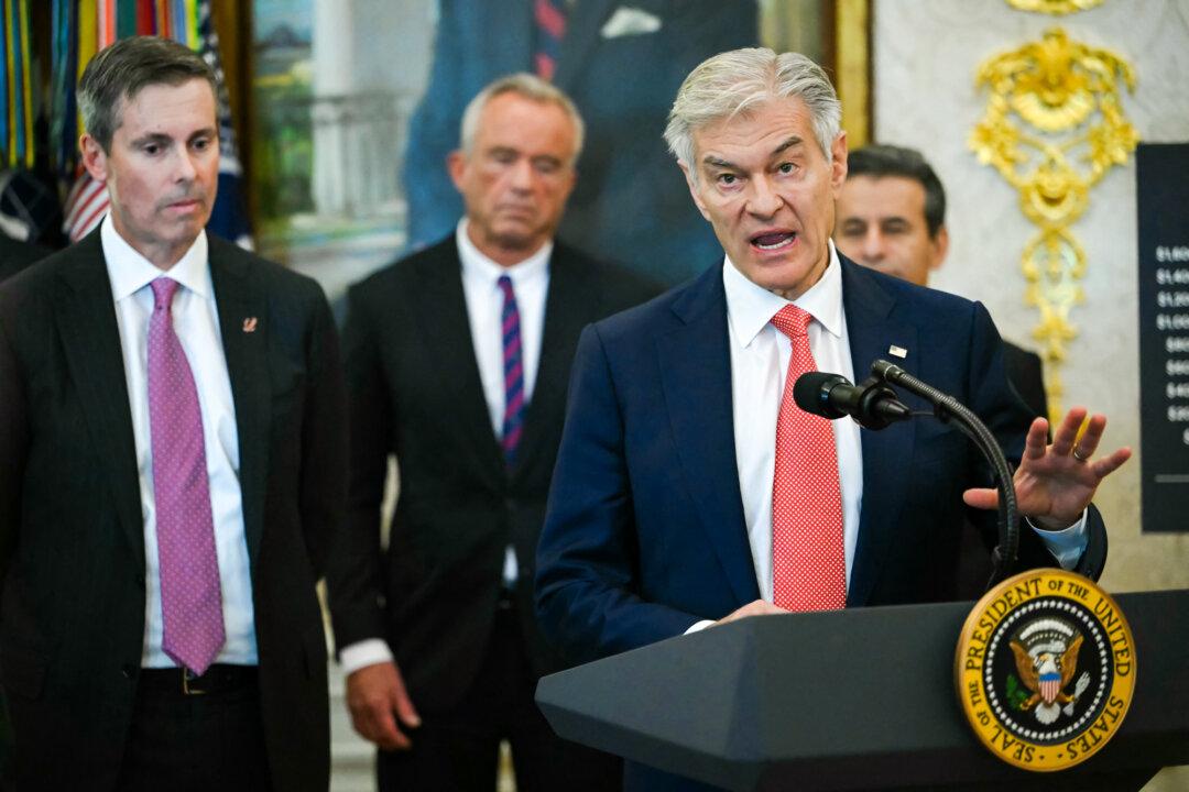 Medicare and Medicaid Administrator Dr. Mehmet Oz speaks at the White House on Nov. 6, 2025. Oz said rising insurance premiums pushed out consumers who did not qualify for subsidies, driving prices even higher. (Andrew Caballero-Reynolds/AFP via Getty Images)