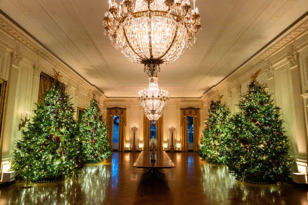 Christmas trees and decor adorn the White House on Dec. 1, 2025. (Madalina Kilroy/The Epoch Times)