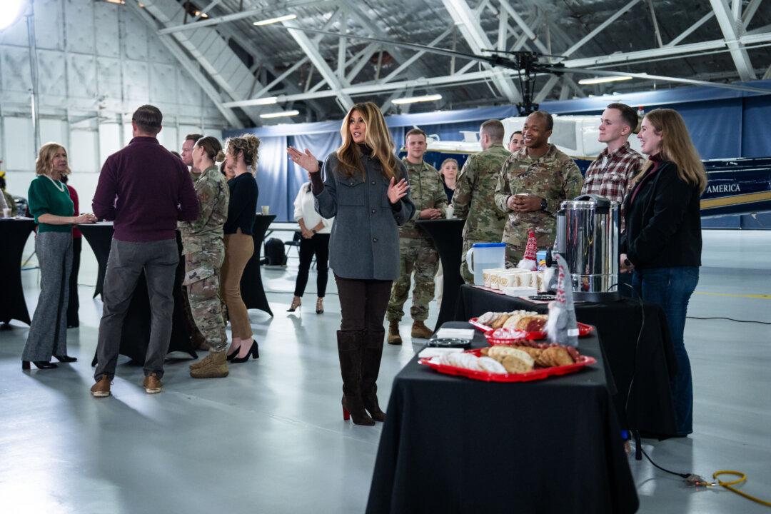 First Lady Melania Trump speaks to military personnel and their families during a Red Cross holiday care package-building and card-writing event at Joint Base Andrews, Md., on Dec. 1, 2025. (Madalina Kilroy/The Epoch Times)