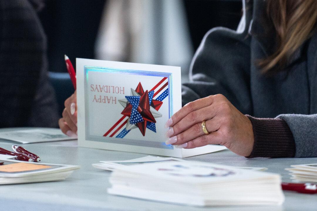 A card written by First Lady Melania Trump during the Red Cross holiday care package-building and card-writing event at Joint Base Andrews, Md., on Dec. 1, 2025. (Madalina Kilroy/The Epoch Times)