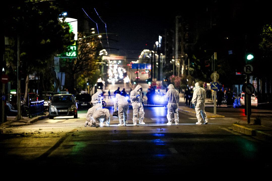 Members of the Greek police counterterrorism unit investigate the area outside Hellenic Train offices after a bomb exploded in Athens on April 11, 2025. The U.S. State Department designated both the Greece-based Revolutionary Class Self-Defense and Armed Proletarian Justice groups as foreign terrorist organizations. (Aris Oikonomou/SOOC/AFP via Getty Images)