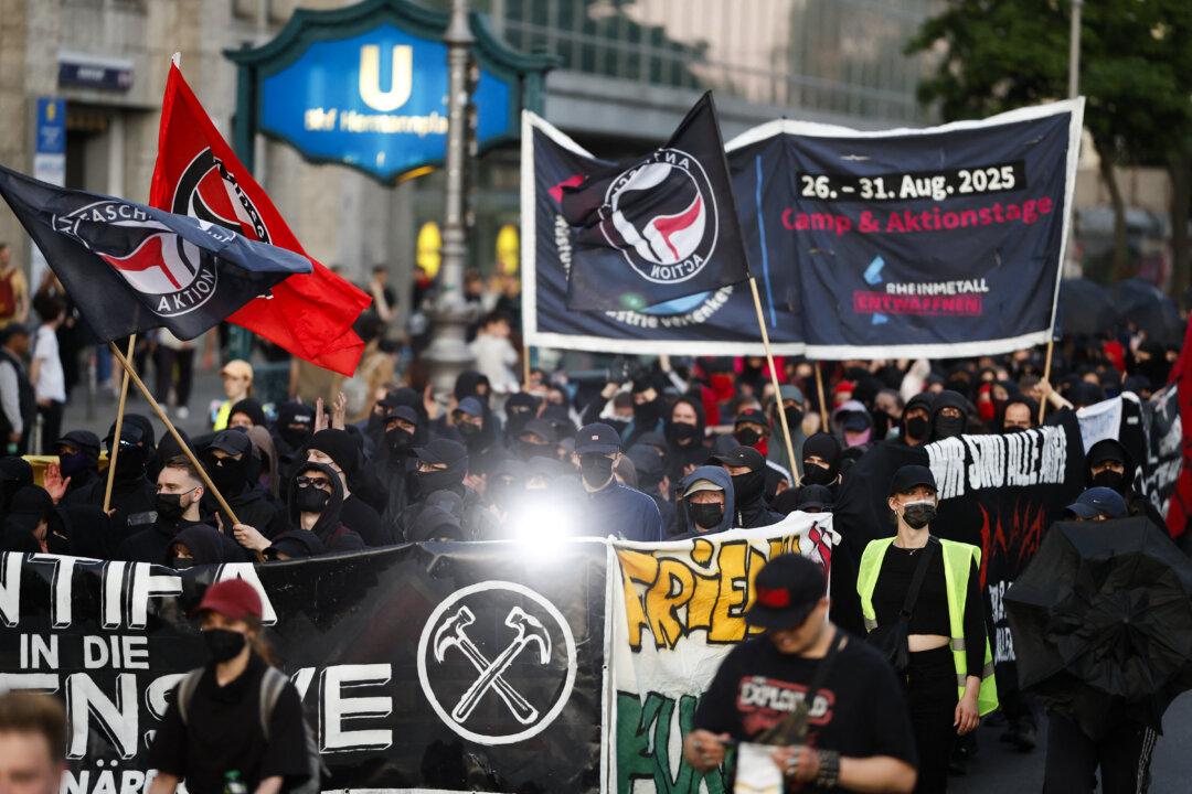 Demonstrators hold Antifa flags and banners during a Revolutionary May Day march in Berlin on May 1, 2025. The Trump administration designated the German group Antifa Ost as a foreign terrorist organization; it is also known as “Hammerbande,” German for “Hammer Gang.” (Odd Andersen/AFP via Getty Images)