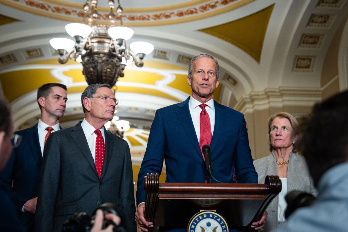 Senate Majority Leader John Thune (R-S.D.), joined by other Senate Republicans, speaks during the weekly press conference on Capitol Hill in Washington on Dec. 2, 2025. (Madalina Kilroy/The Epoch Times)