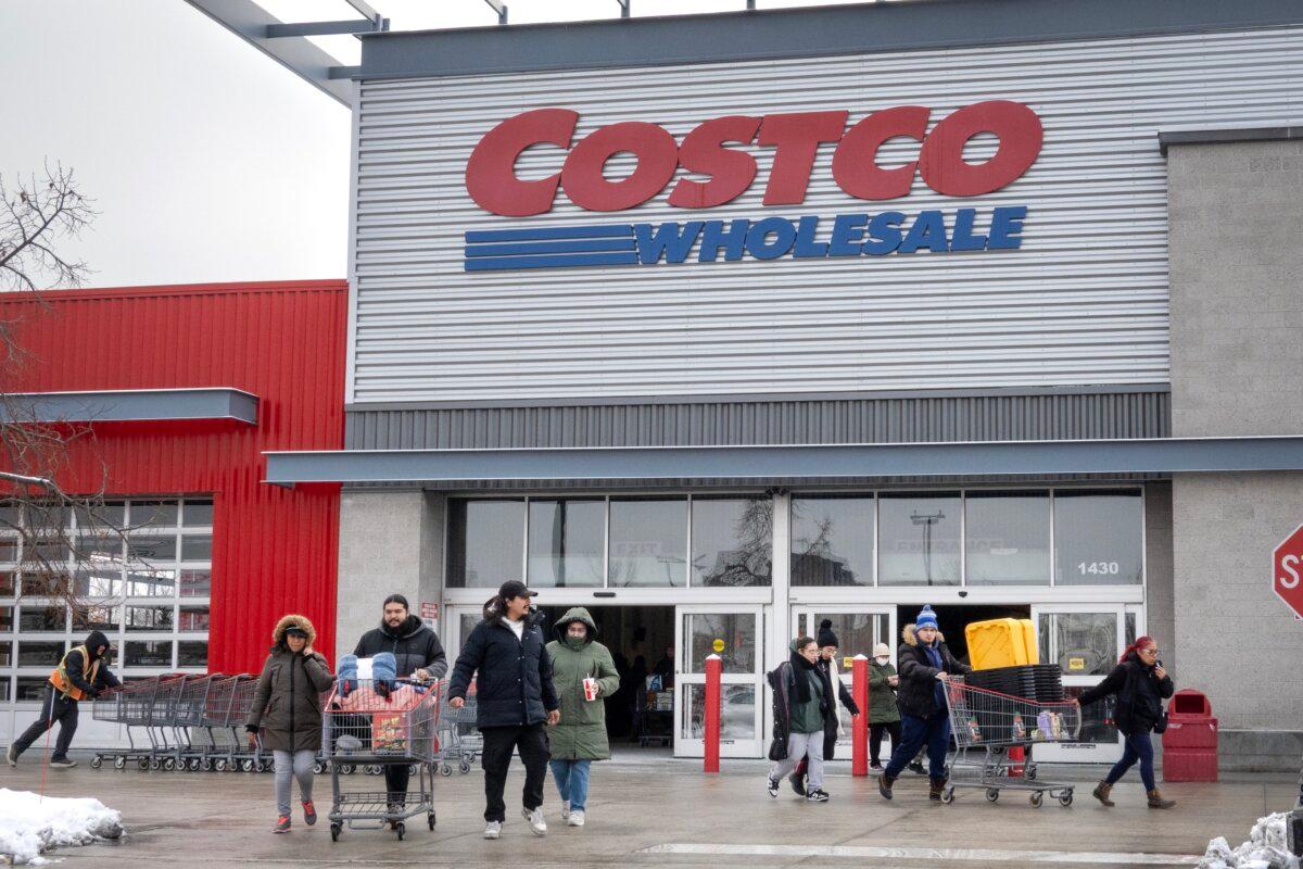 Customers walk in the parking lot outside a Costco store in Chicago on Dec. 2, 2025. (Scott Olson/Getty Images)