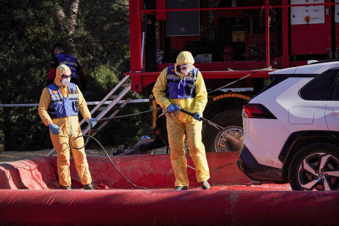 Members of Spain's Military Emergency Unit decontaminate a vehicle in the area of an outbreak of African swine fever found in wild bores near Cerdanyola del Valles, outside Barcelona, on Dec. 3, 2025. (Manaure Quintero/AFP via Getty Images)