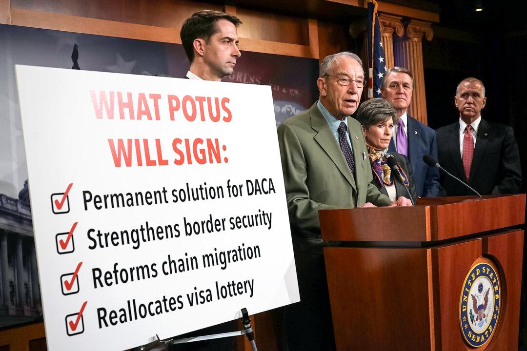 Sen. Chuck Grassley (R-Iowa) (2nd L) speaks during a news conference at the U.S. Capitol on Feb. 12, 2018. In September, Grassley and Sen. Dick Durbin (D-Ill.) joined forces and questioned major corporations that filed thousands of H-1B visa petitions. (Alex Wong/Getty Images)