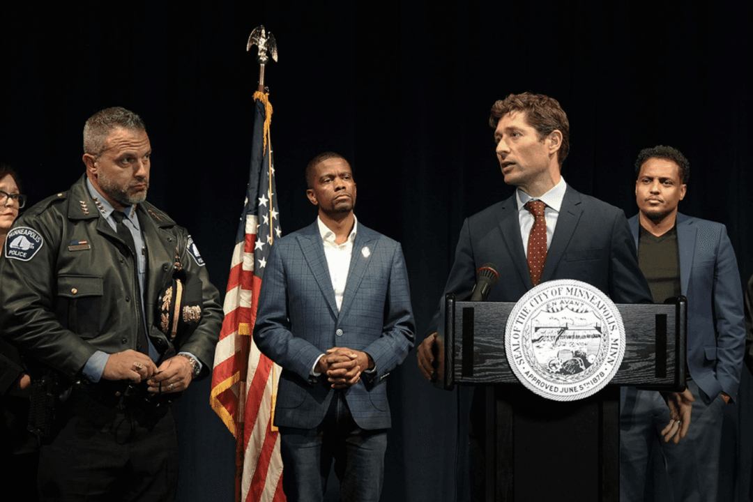 Minneapolis Mayor Jacob Frey speaks at the podium during a news conference defending the Somali community and expressing concern over imminent immigration enforcement, joined by Minneapolis Police Chief Brian O'Hara (L); Melvin Carter III, mayor of St. Paul, Minn. (2L), and Minneapolis City Councilman Jamal Osman (R), who describes himself as a Somali American, in Minneapolis on Dec. 2, 2025. (Courtesy of City of Minneapolis, Minneapolismn.gov)
