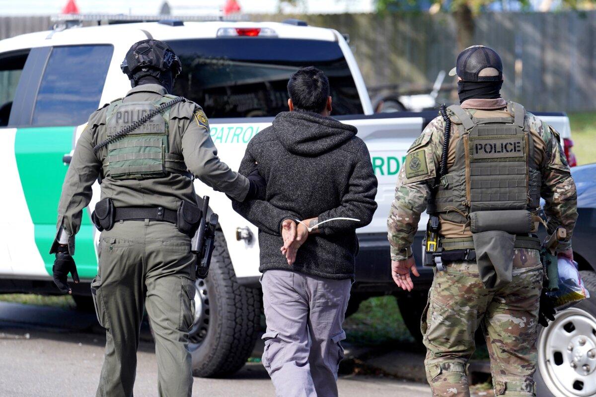 U.S. Border Patrol agents detain a man on the street in New Orleans on Dec. 3, 2025. (Ryan Murphy/Getty Images)