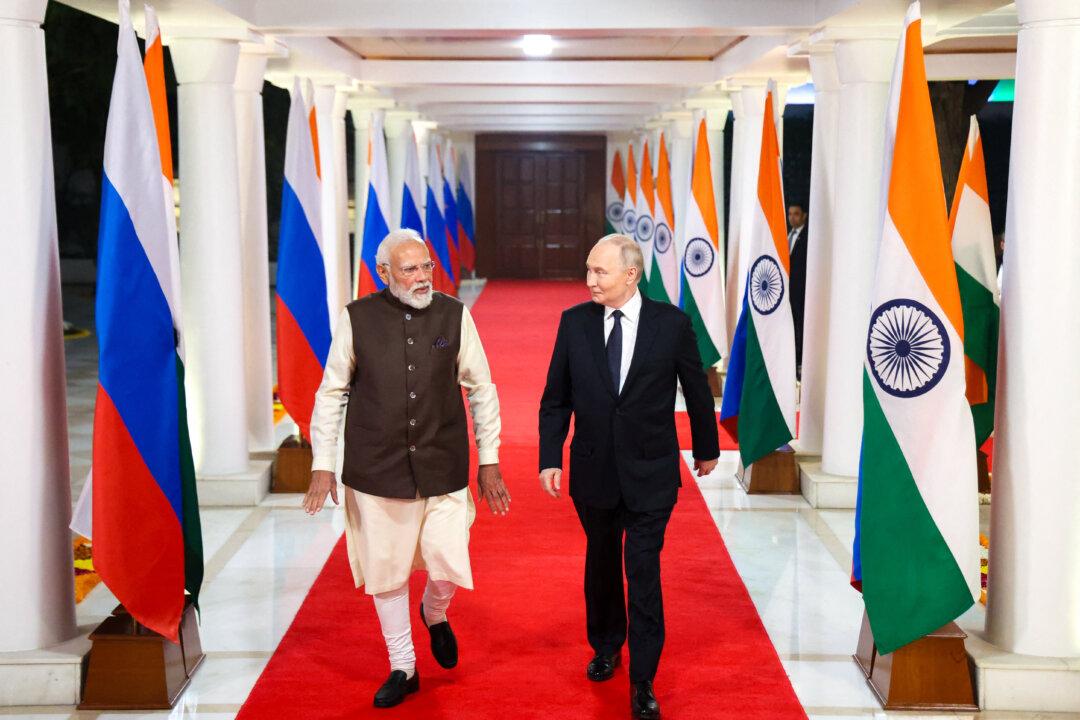 Russia's President Vladimir Putin and Indian Prime Minister Narendra Modi walk prior to an informal dinner at Modi's residence in New Delhi, on Dec. 4, 2025, the first day of the Russian leader's two-day state visit to India. (Alexander Kazakov/POOL/AFP via Getty Images)