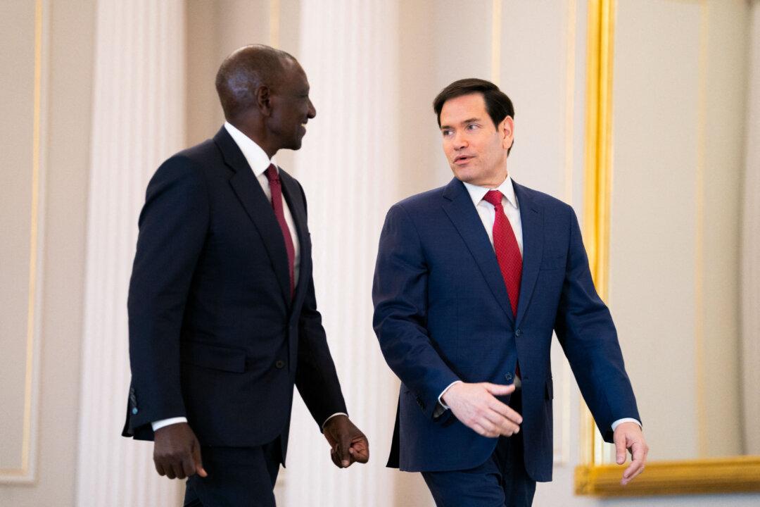 U.S. Secretary of State Marco Rubio speaks with Kenyan President William Ruto as they arrive for a Health Framework of Cooperation signing ceremony at the State Department in Washington on Dec. 4, 2025. The $2.5 billion deal is the first such bilateral agreement after President Donald Trump shut down the USAID agency and ended many contracts with nongovernmental organizations. (Allison Robbert/AFP via Getty Images)
