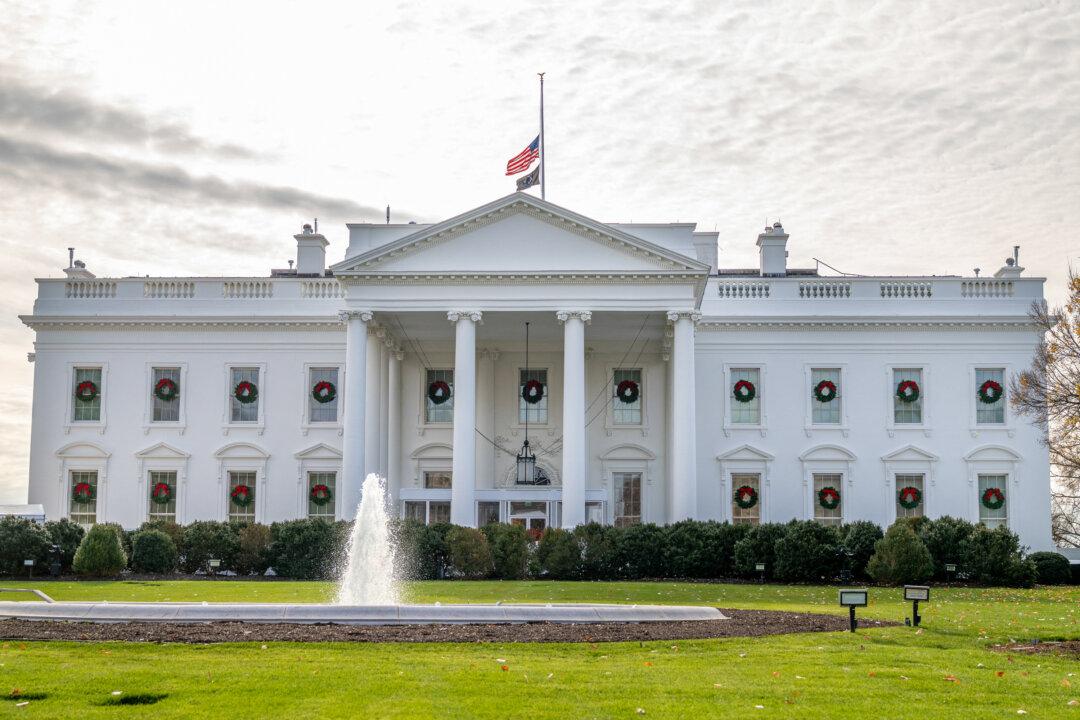 The U.S. flag is lowered to half mast at the White House in Washington on Dec. 4, 2025, in honor of Sarah Beckstrom, the National Guard member who was fatally shot last week. (Daniel Heuer/AFP via Getty Images)