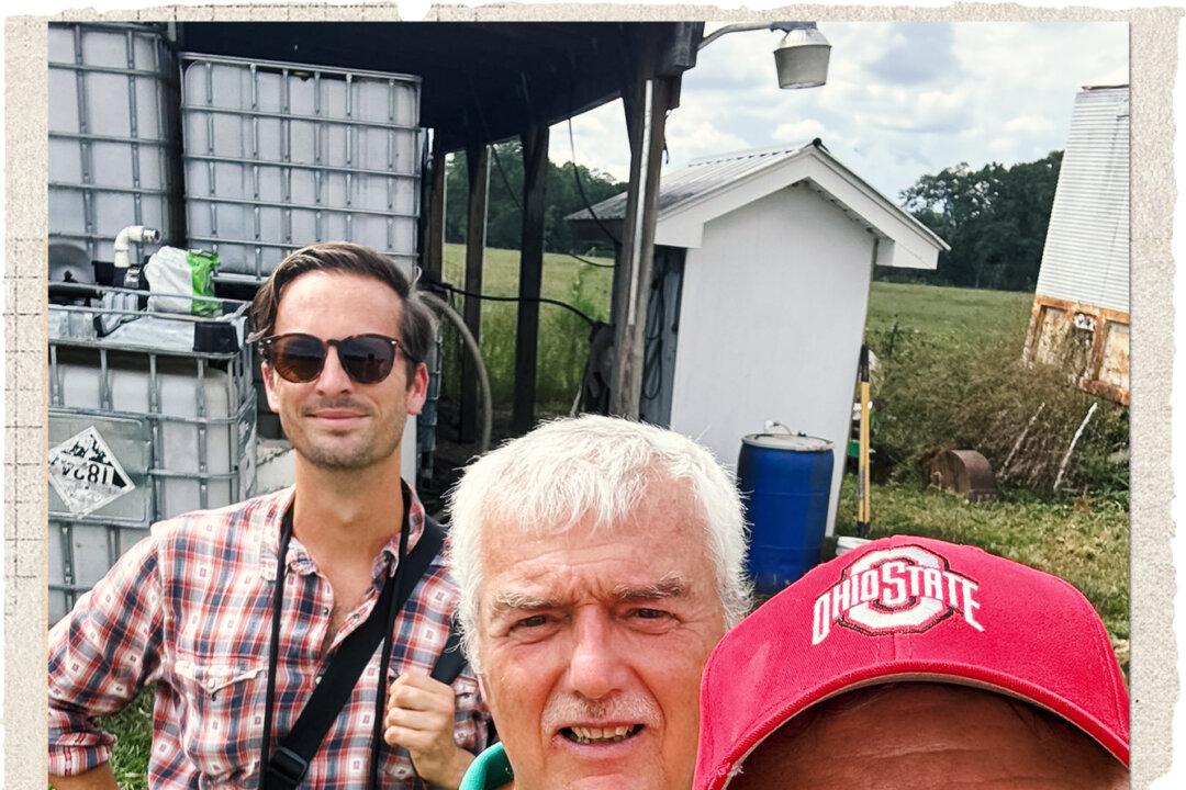 Epoch Times reporter Jeff Louderback (front) and photographer John Fredricks (back) tour Ben Simmons’s Nature’s Gourmet Farm in Petal, Miss., in September 2025. Louderback said reporting on Robert F. Kennedy Jr., the MAHA movement, and regenerative farming revealed to him that the food supply is laced with chemicals, prompting him to shift to whole foods and herbs. (Jeff Louderback/The Epoch Times)