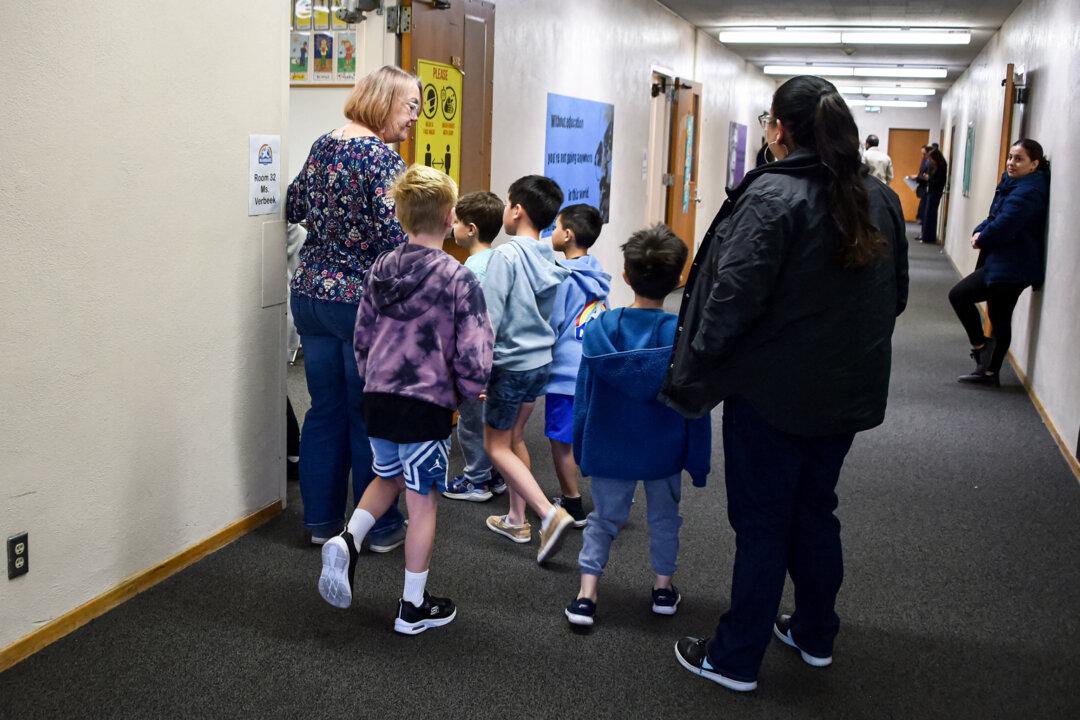 A teacher conducts a tour of Nora Sterry Elementary School to displaced students from Marquez Elementary School, which was destroyed in the Pacific Palisades fire, in Los Angeles on Jan. 15, 2025. (Chris Delmas/AFP via Getty Images)