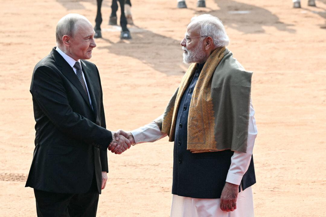 Russian President Vladimir Putin shakes hands with Indian Prime Minister Narendra Modi during his ceremonial reception at India's presidential palace, Rashtrapati Bhavan, in New Delhi on Dec. 5, 2025. (Sajjad Hussain/AFP via Getty Images)