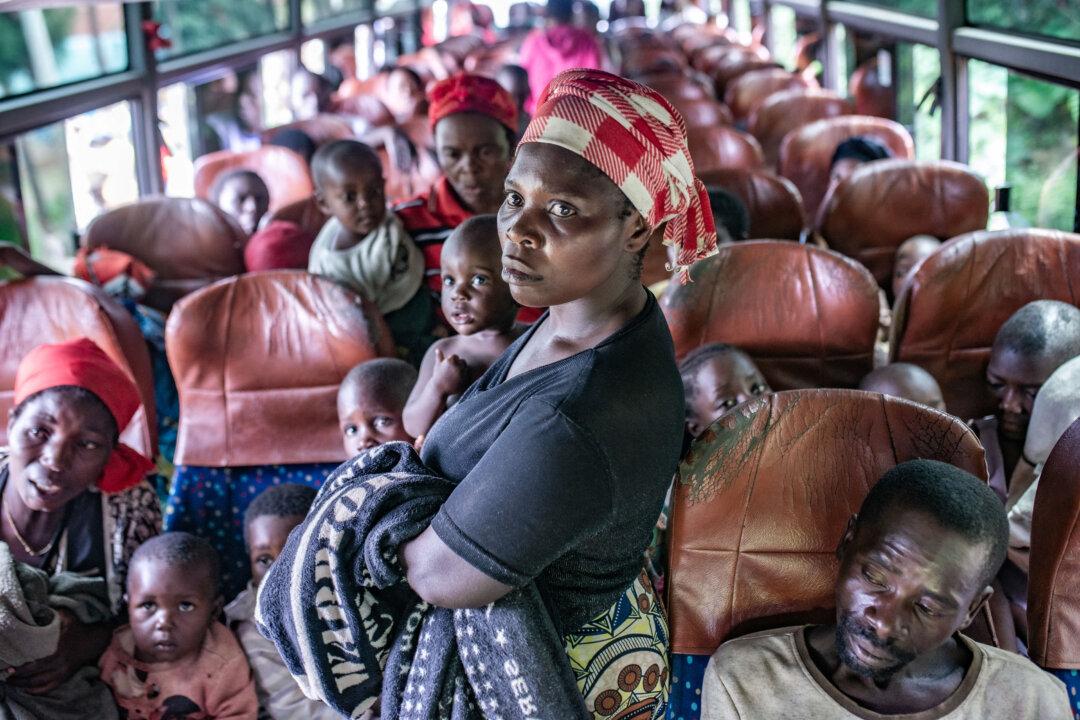 Displaced people from Congo gather in a bus after fleeing intense shelling in the bordering Kamanyola region upon their arrival in Bugarama, Rwanda, on Dec. 5, 2025. Hundreds of civilians in eastern Congo crossed the border into Rwanda on Friday, fleeing intense shelling that occurred the day after the ratification of a peace agreement between Congo and Rwanda. (AFP via Getty Images)