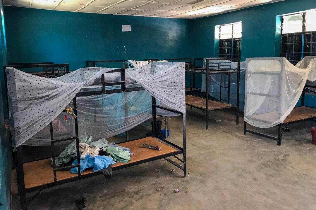 (Top) A general view of a classroom at St. Mary's Catholic School in Papiri, Agwarra local government, Niger state, Nigeria, on Nov. 23, 2025. (Bottom L) A signboard for St Mary's Private Catholic Secondary School stands at the entrance of the school in Papiri, Agwarra local government, Niger state, Nigeria, on Nov. 23, 2025. (Bottom R) A general view of empty bunk beds and scattered belongings inside a student dormitory at St. Mary's Catholic School in Papiri, Agwarra local government, Niger state, Nigeria, on Nov. 23, 2025. (Ifeanyi Immanuel Bakwenye/AFP via Getty Images)
